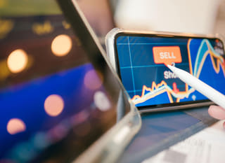 Trader working across multiple markets, reviewing forex options alongside Bitcoin and Ethereum